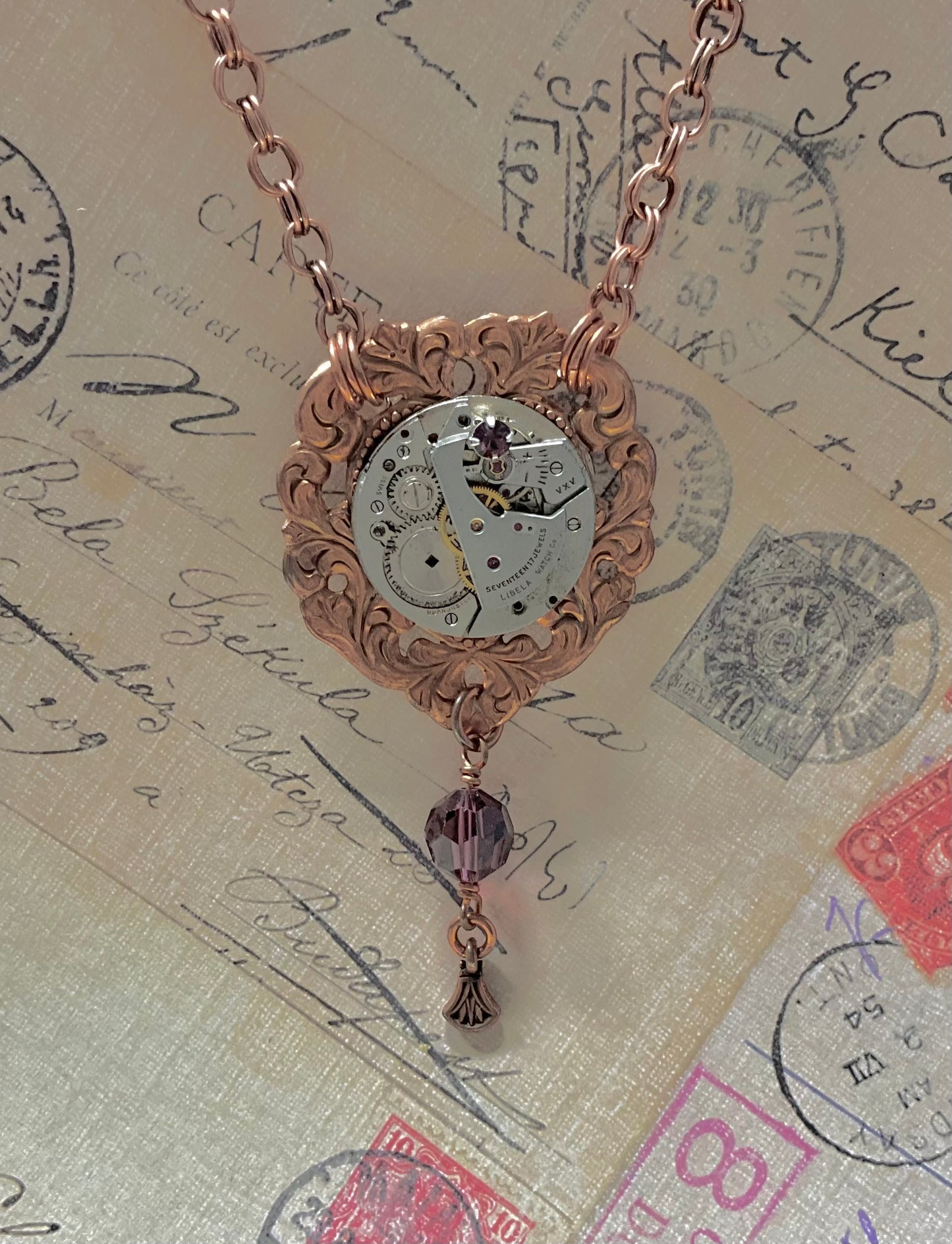 copper necklace with vintage watch and purple crystals
