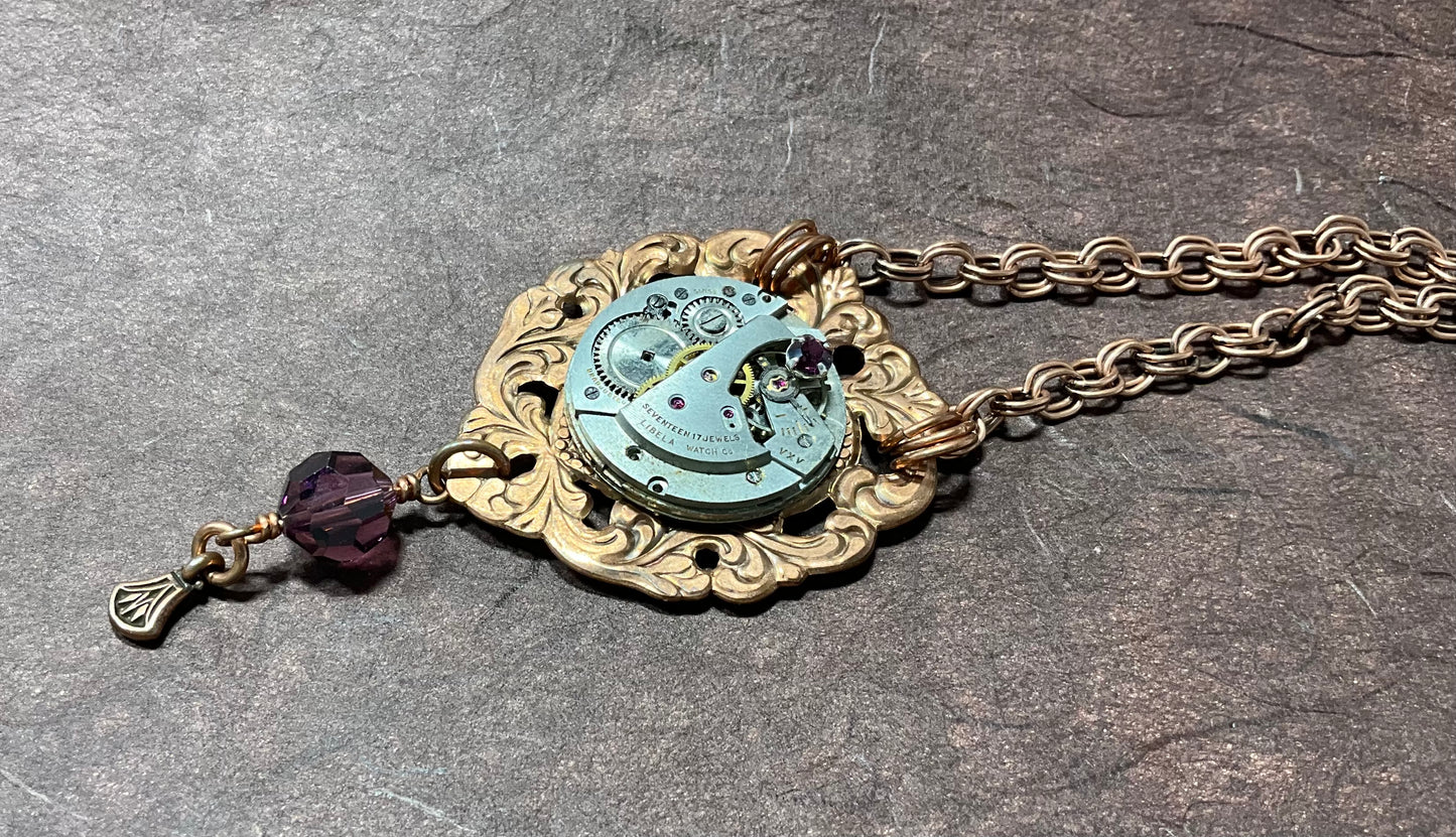 copper necklace with vintage watch and purple crystals