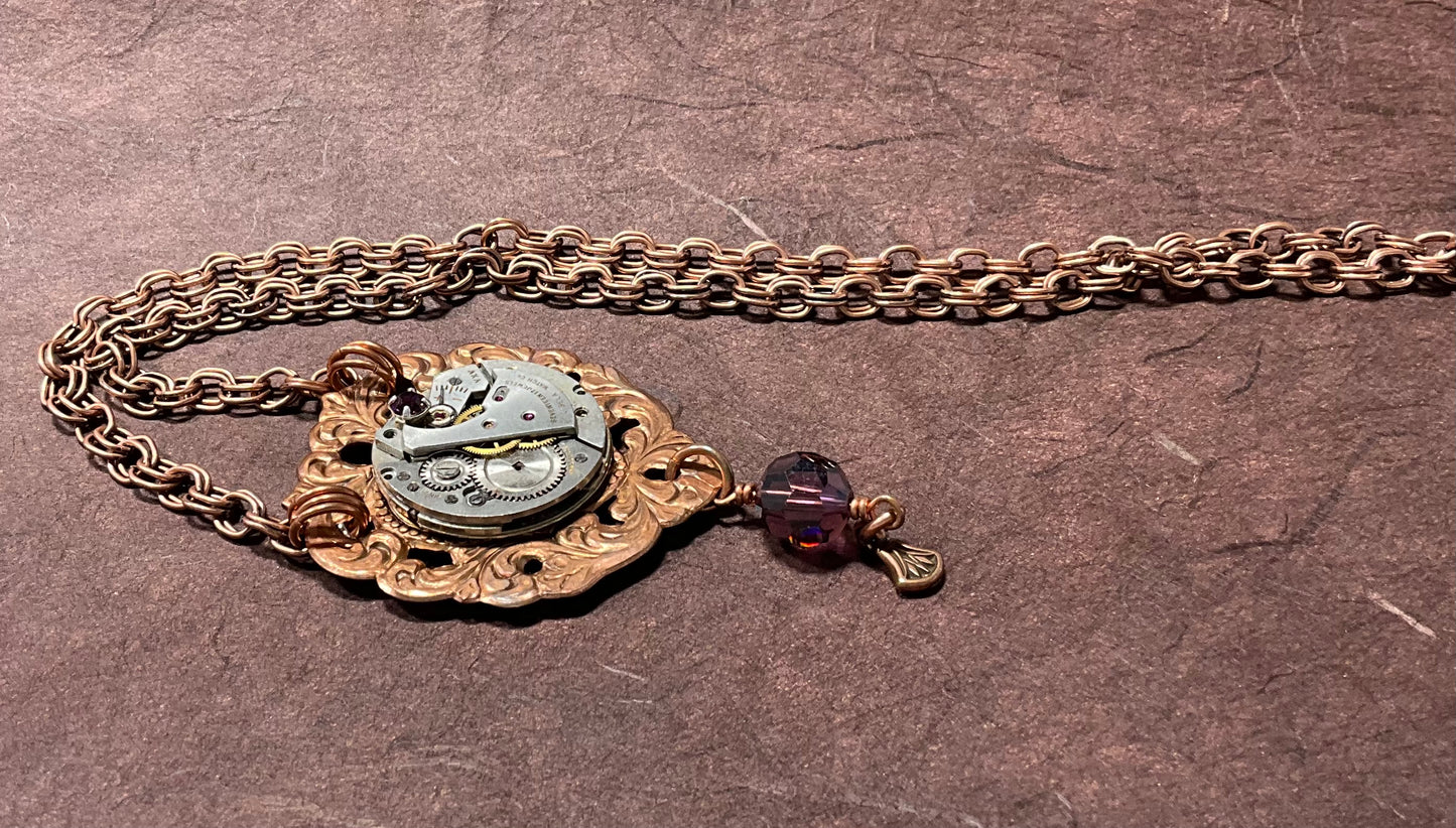 copper necklace with vintage watch and purple crystals