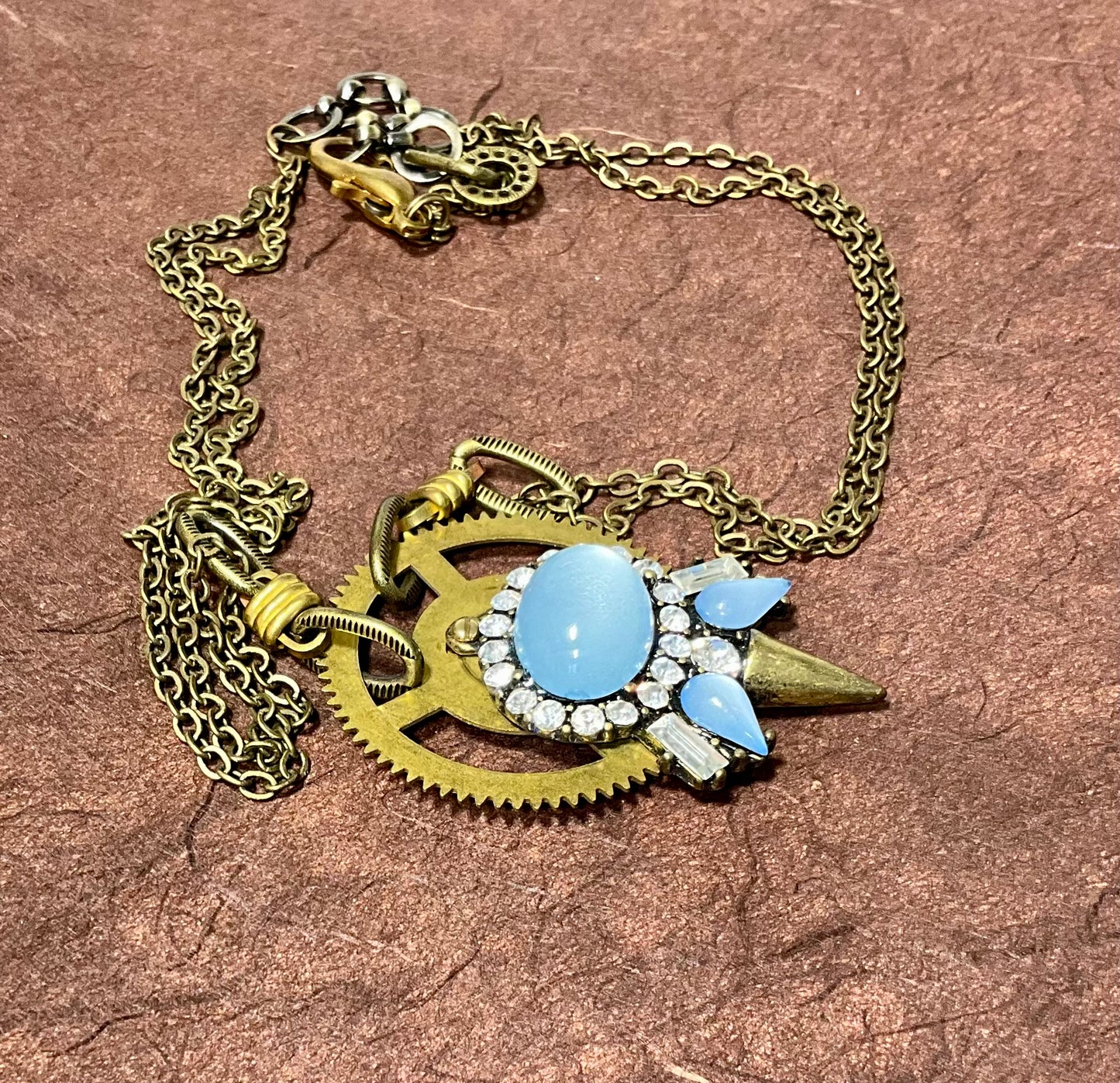 recycled necklace part and antique clock gear necklace in blue and crystals