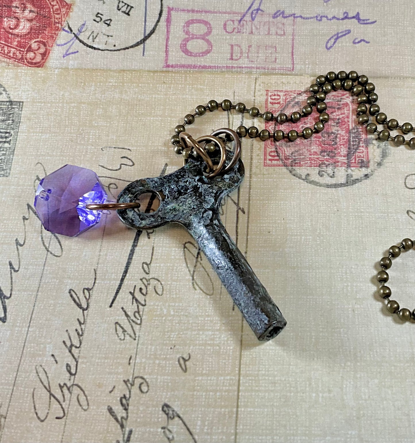 patina key necklace with tanzanite crystal
