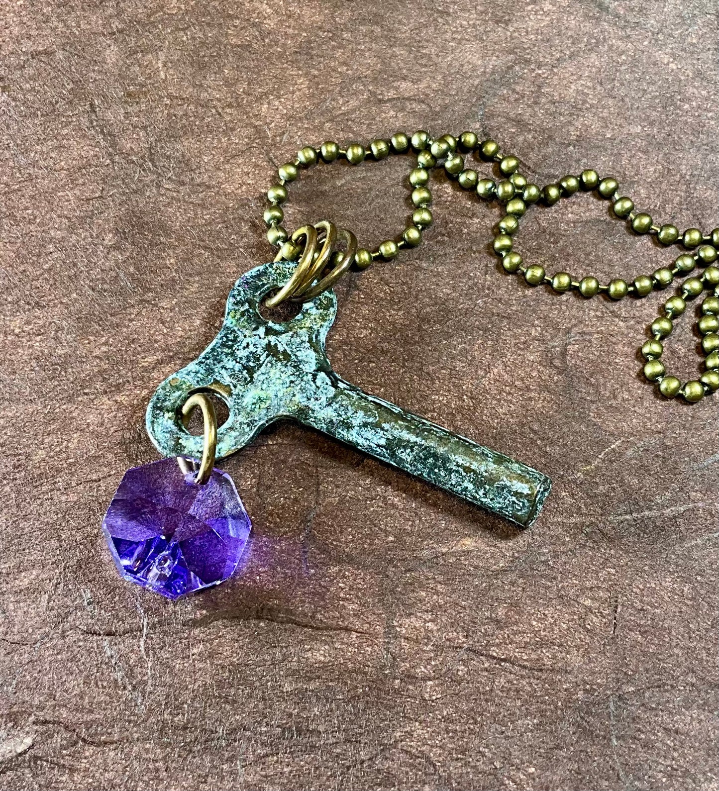 patina key necklace with tanzanite crystal