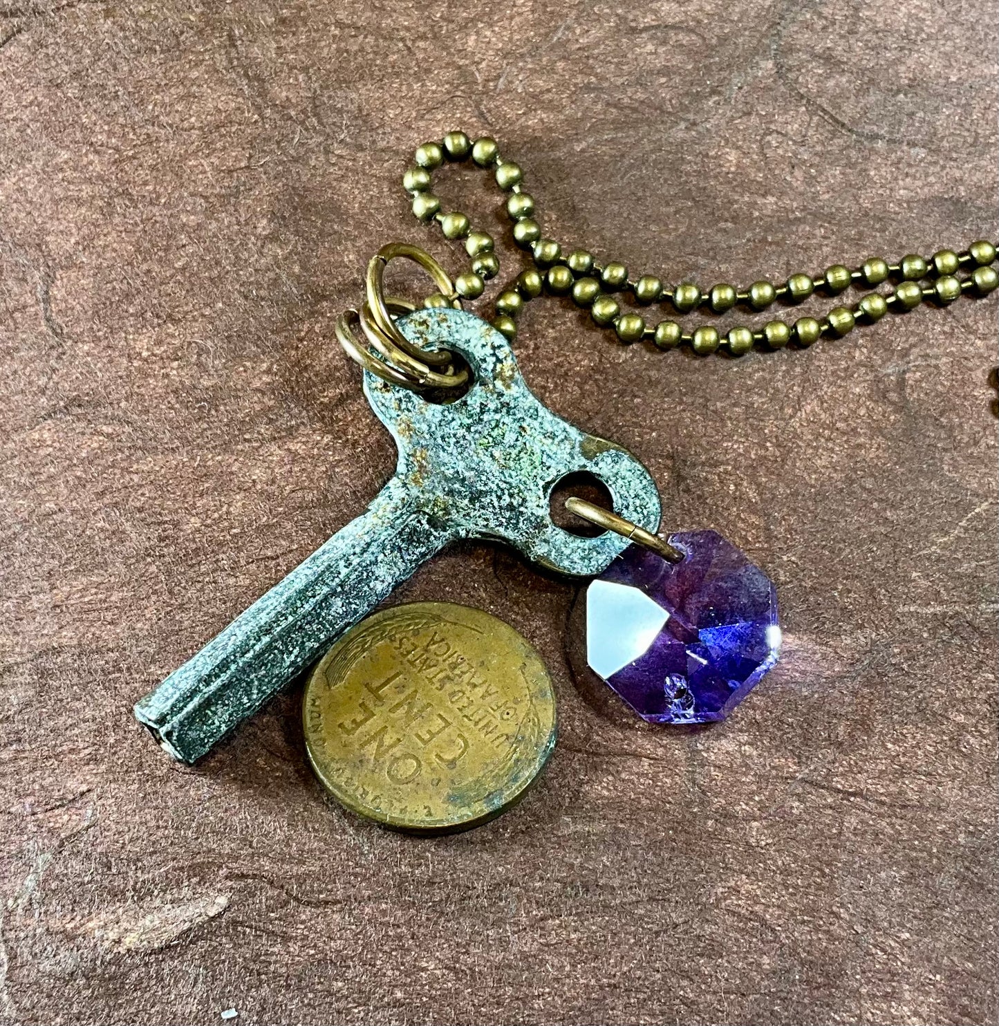 patina key necklace with tanzanite crystal