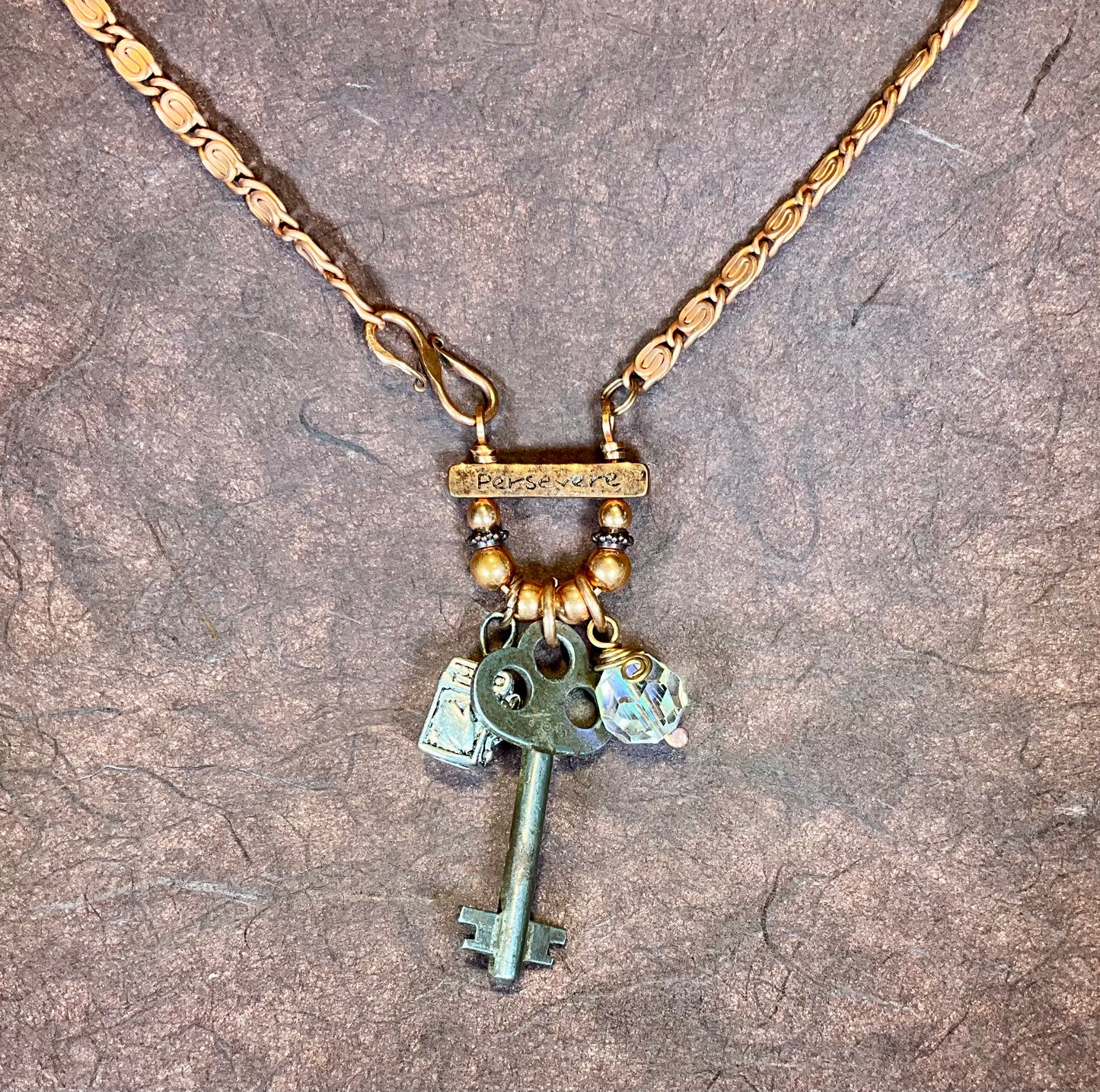 key prayer box crystal Persevere necklace in copper