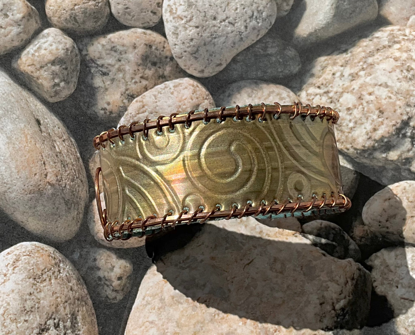 old bronze weatherstripping & copper cuff lined with teal rcycled leather
