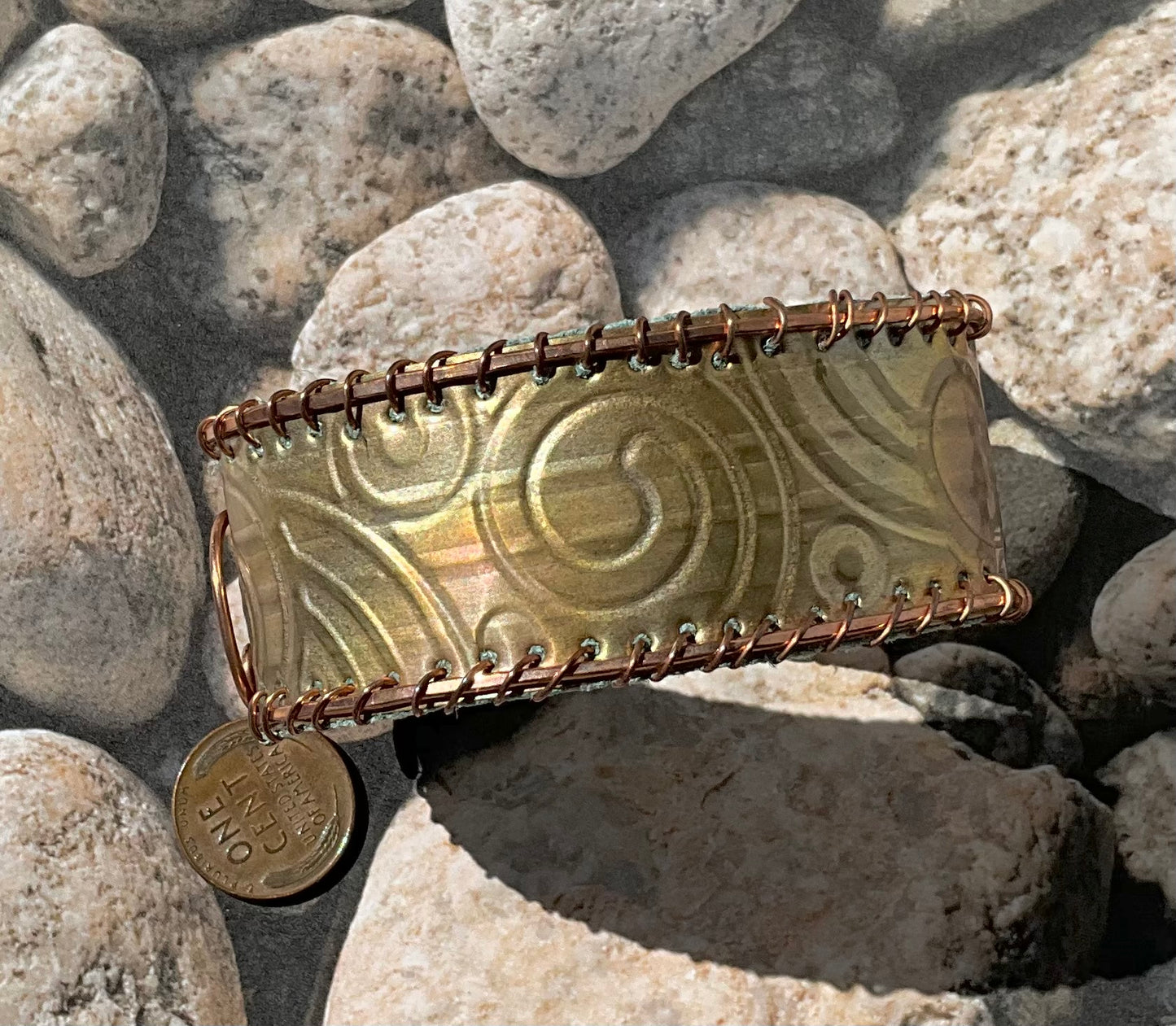 old bronze weatherstripping & copper cuff lined with teal rcycled leather