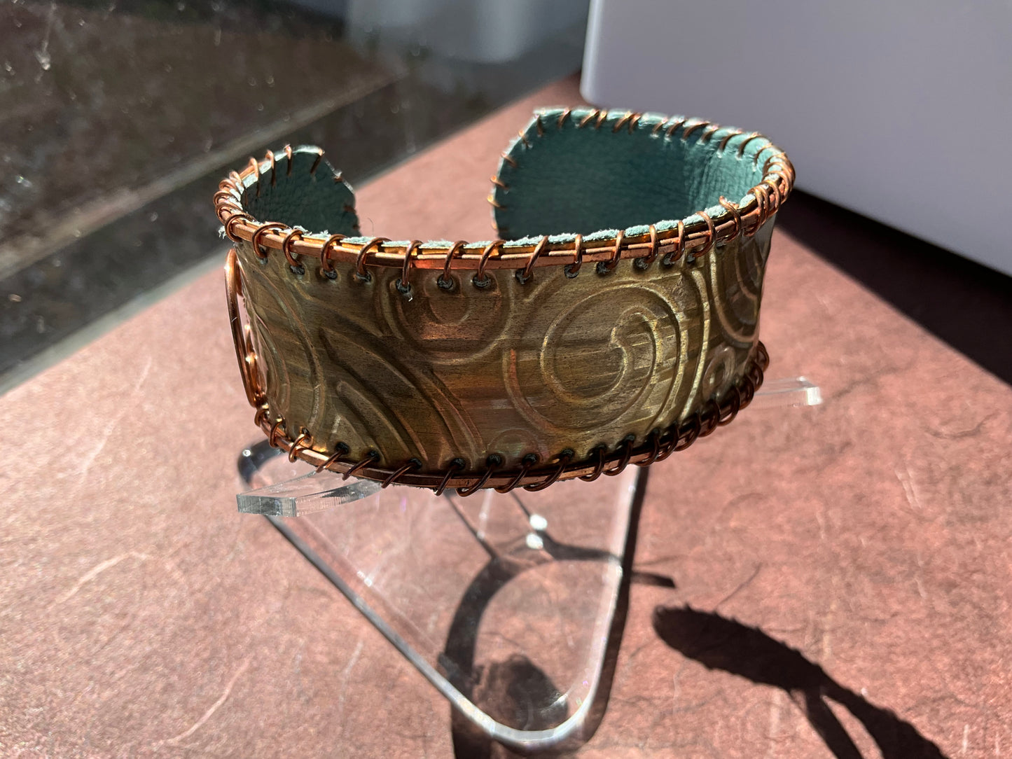 old bronze weatherstripping & copper cuff lined with teal rcycled leather