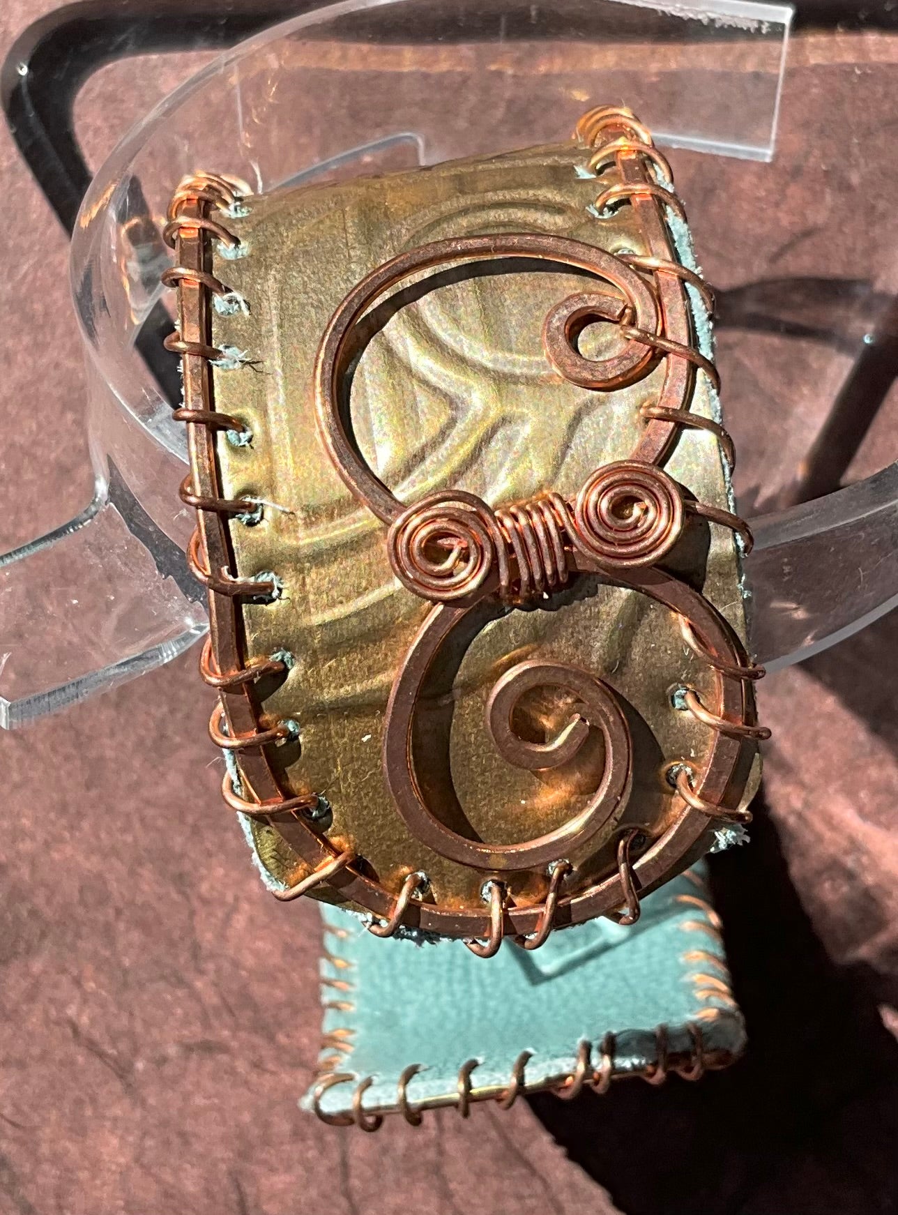 old bronze weatherstripping & copper cuff lined with teal rcycled leather