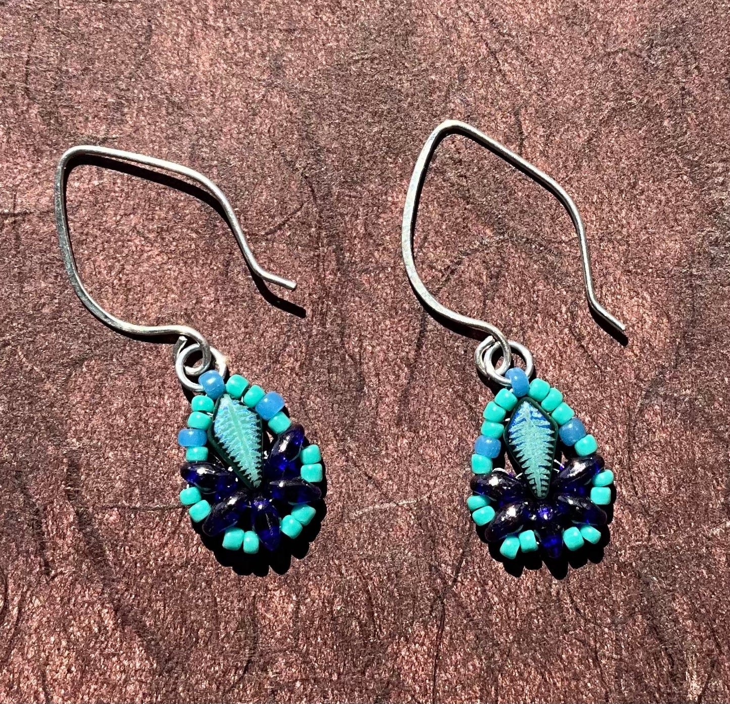 teal and cobalt blue woven leaf earrings