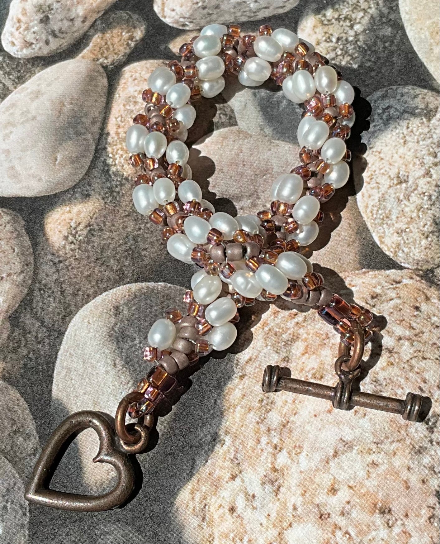 Spiral bracelet featuring pearls