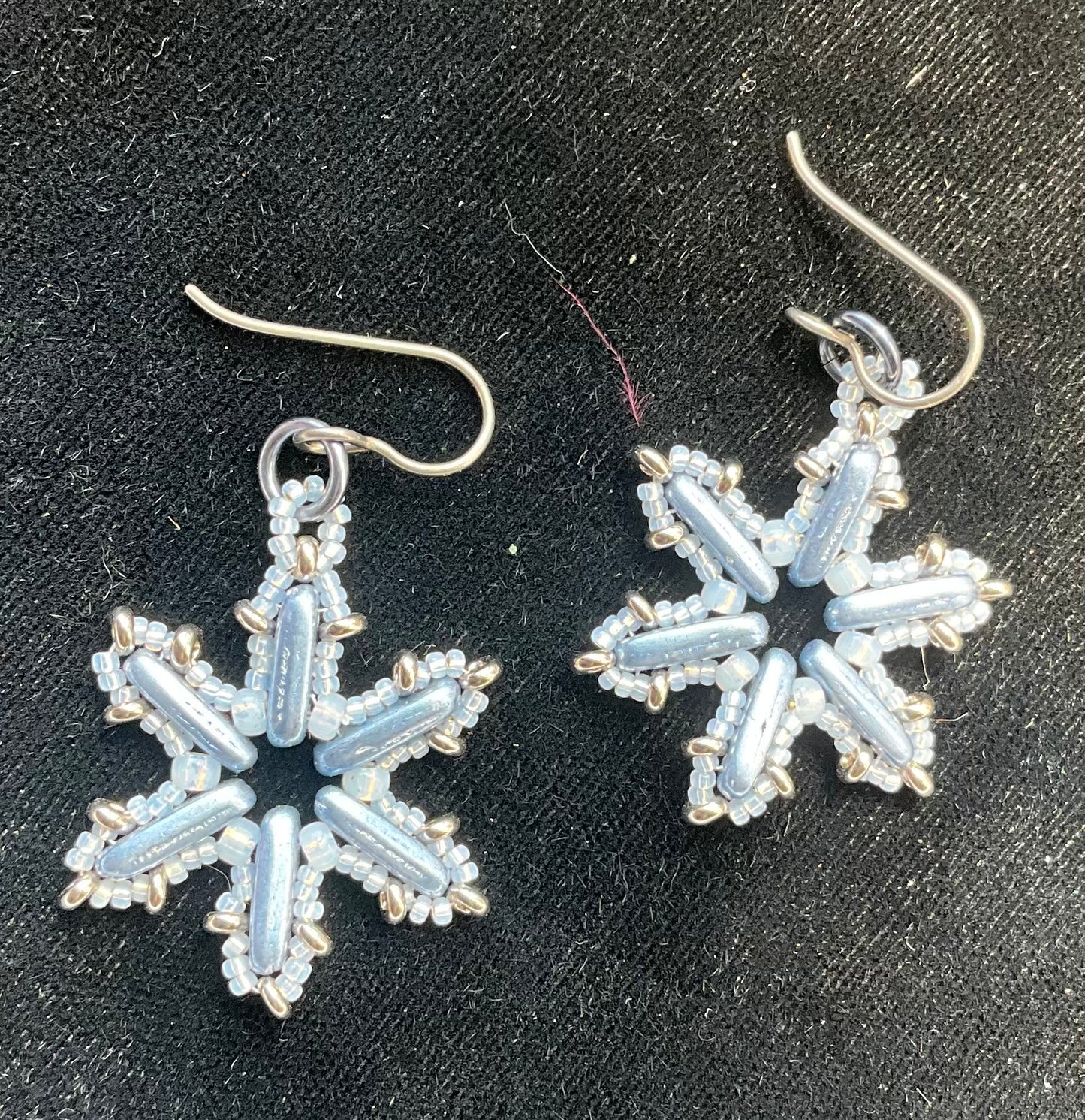 Woven glass snowflake earrings