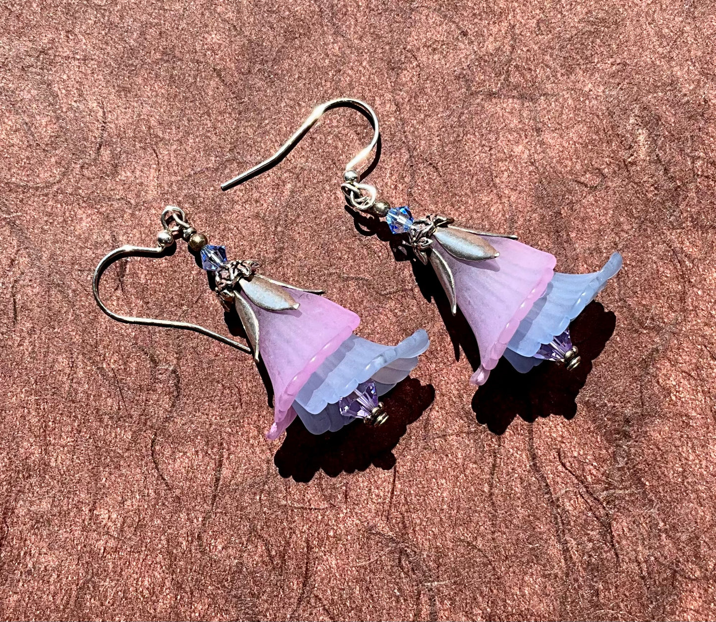 layered blue and purple flower earrings