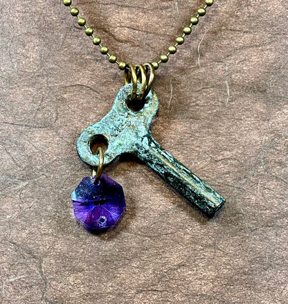 patina key necklace with tanzanite crystal