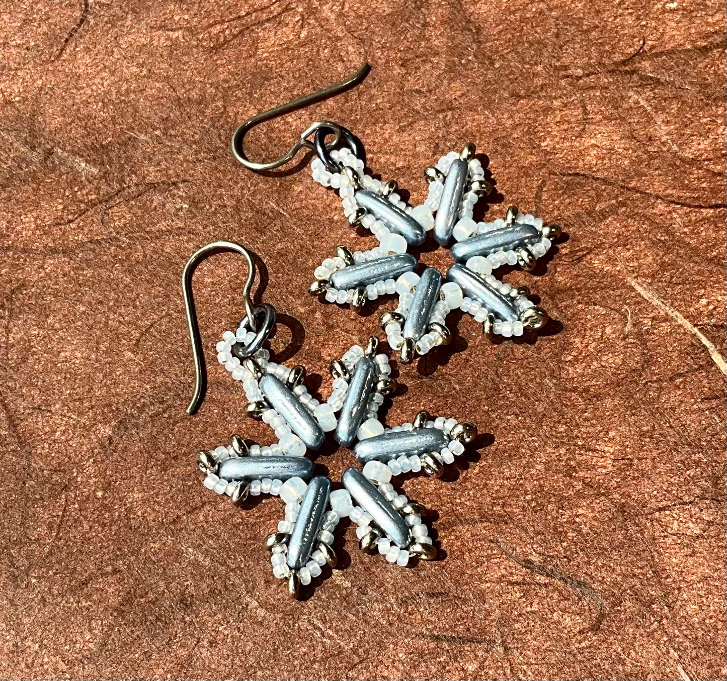 Woven glass snowflake earrings