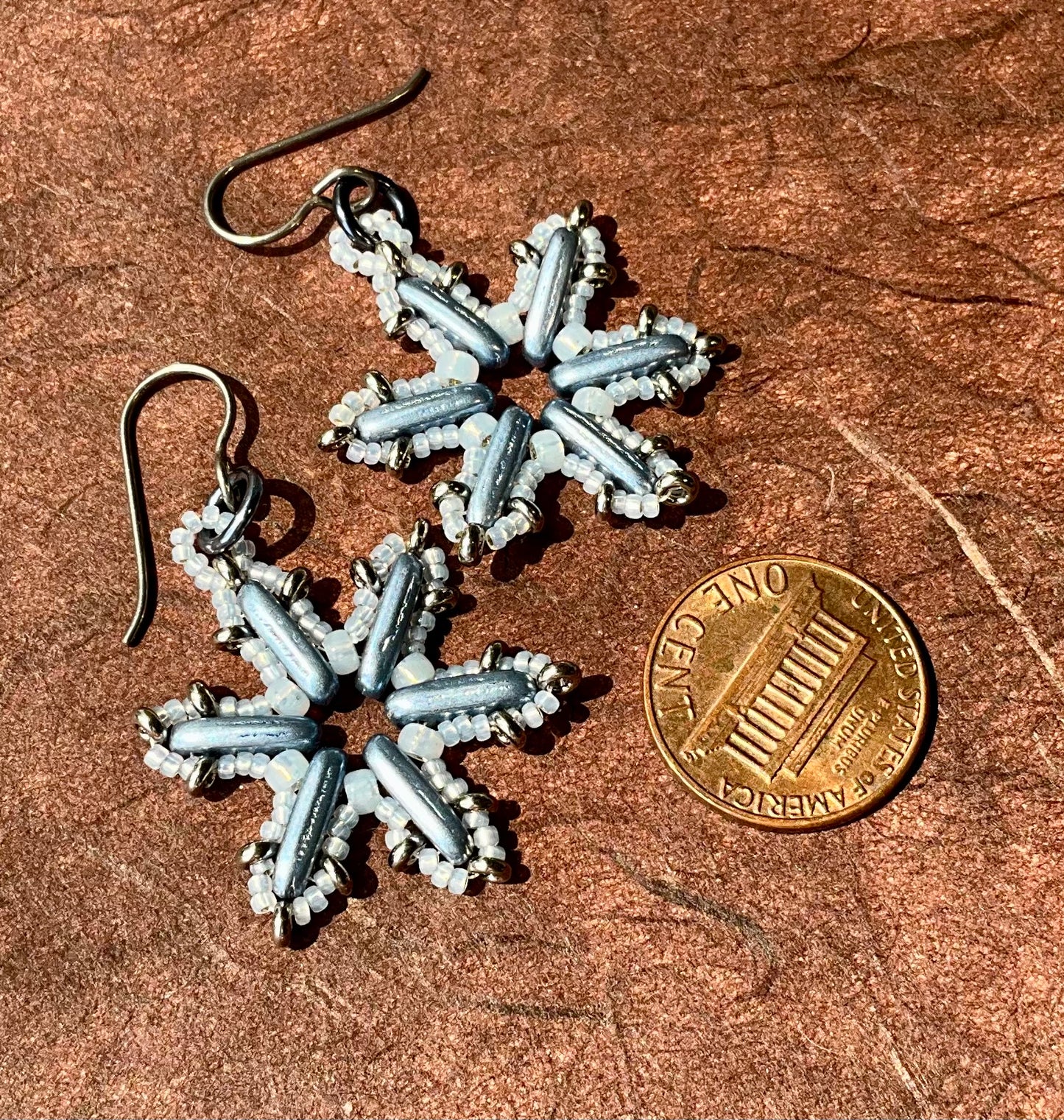 Woven glass snowflake earrings